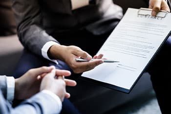 Customer Signing A Contract — Accounting in Bundall, QLD